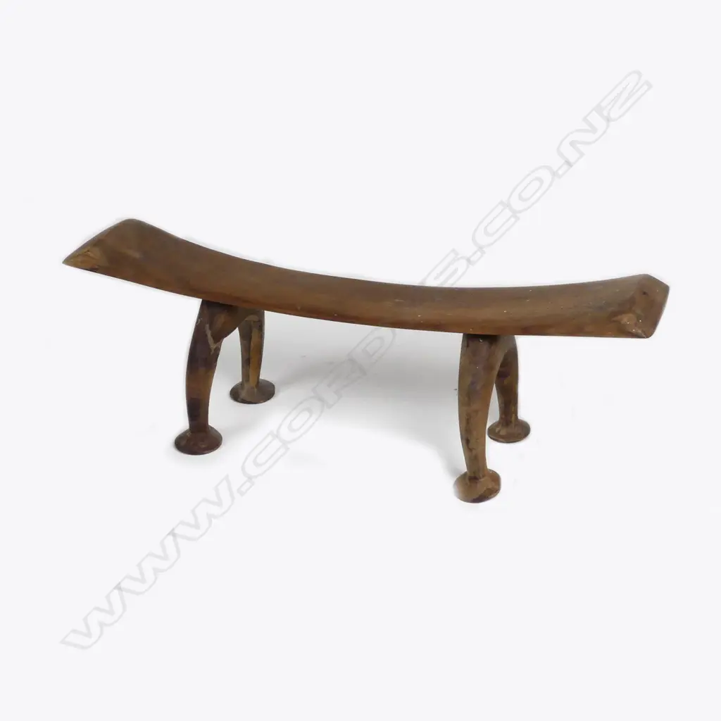 A Tongan Kali head rest with arched legs and pad feet Image 1++