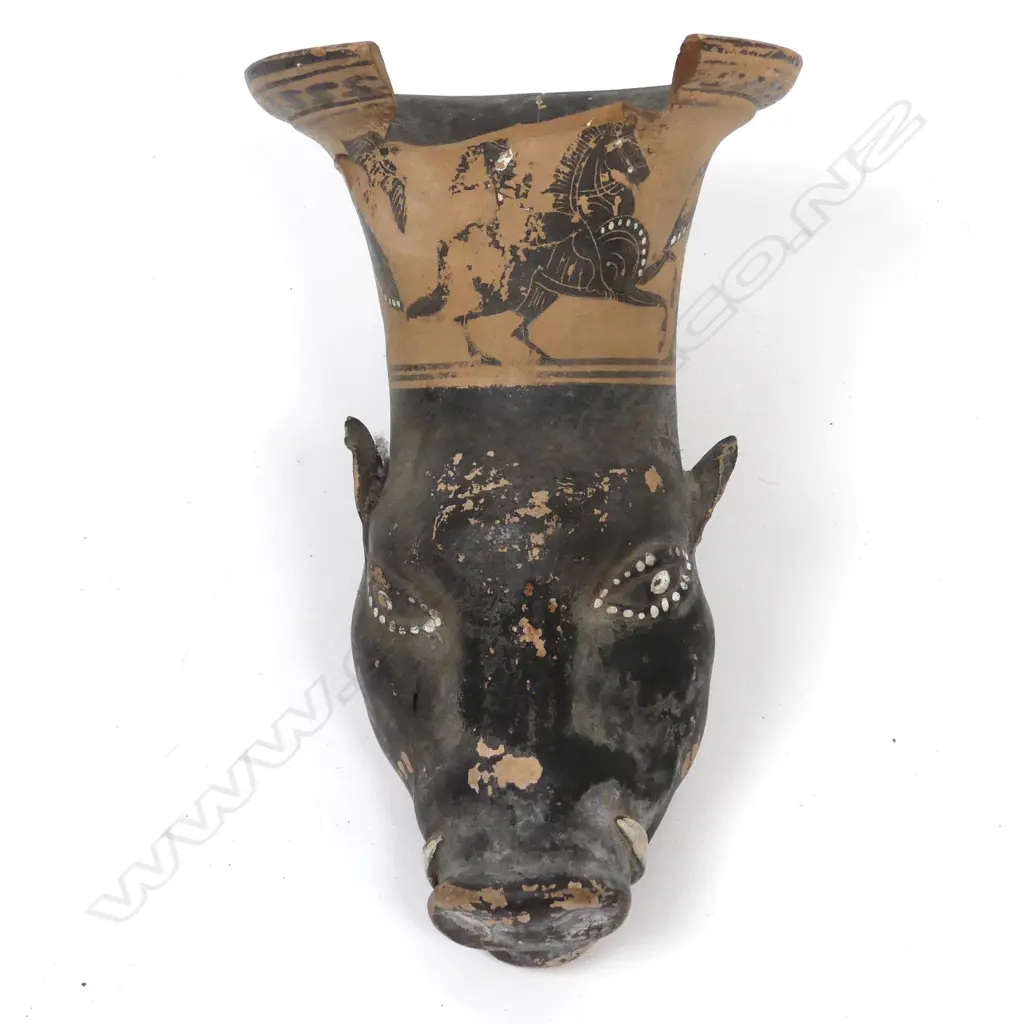 An antique Greek rhyton (drinking-horn) in the shape of a boar's head Image 1++