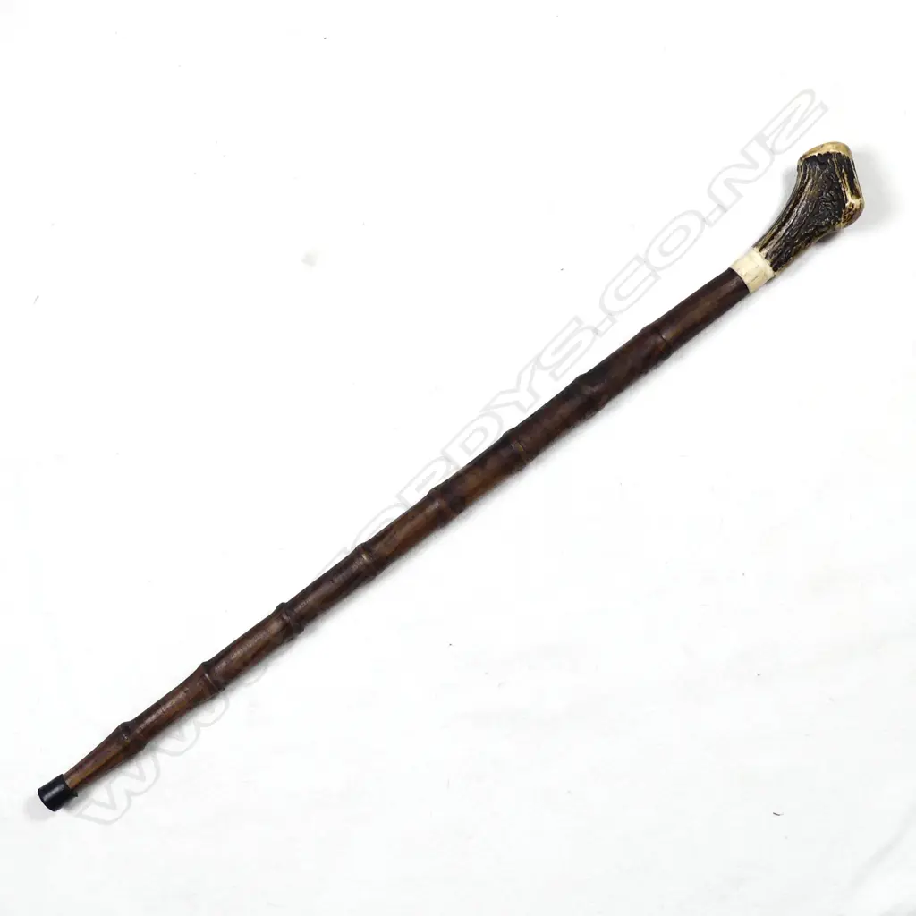 A sturdy turned mahogany walking stick Image 1++