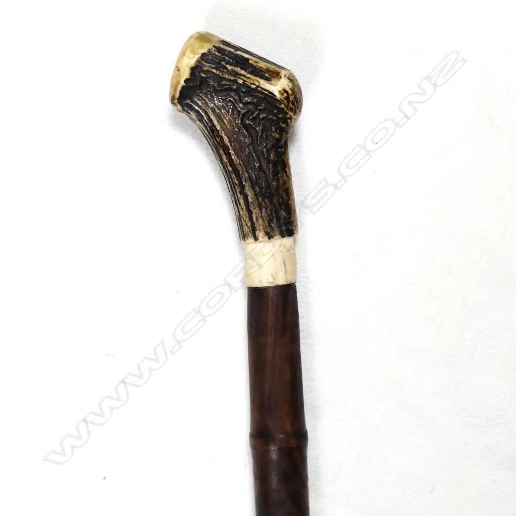 A sturdy turned mahogany walking stick Image 1++