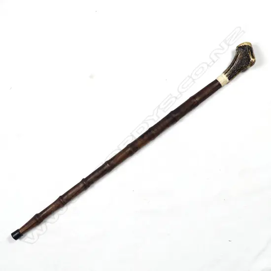 A sturdy turned mahogany walking stick