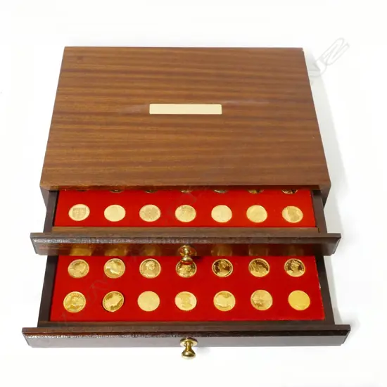 A cased set of 70 silver gilt commemorative medallions
