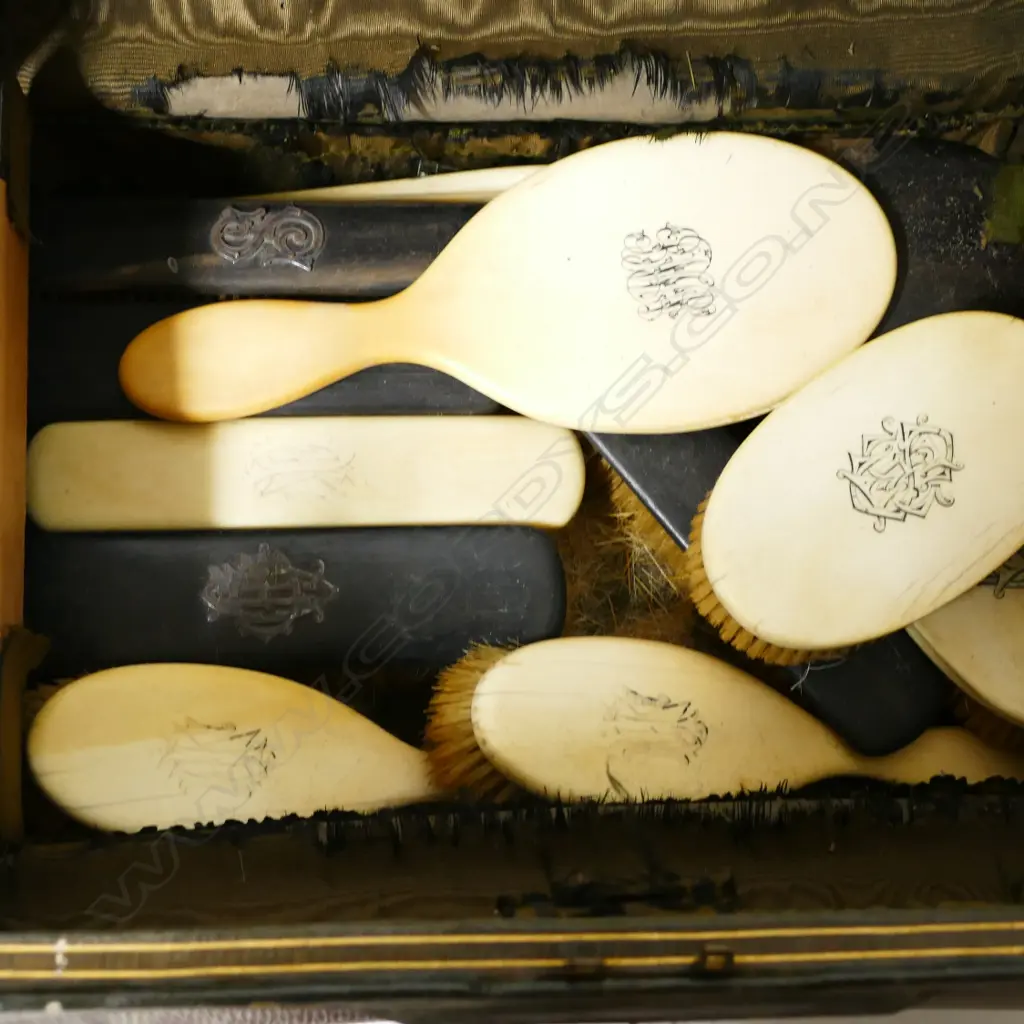 A Victorian Edwards & Sons gentleman's travelling valise with contents of ivory and ebony backed brushes Image 1++