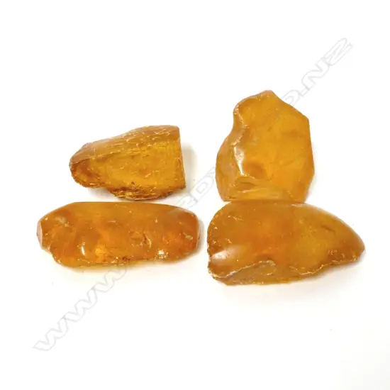 Four pieces of polished kauri gum