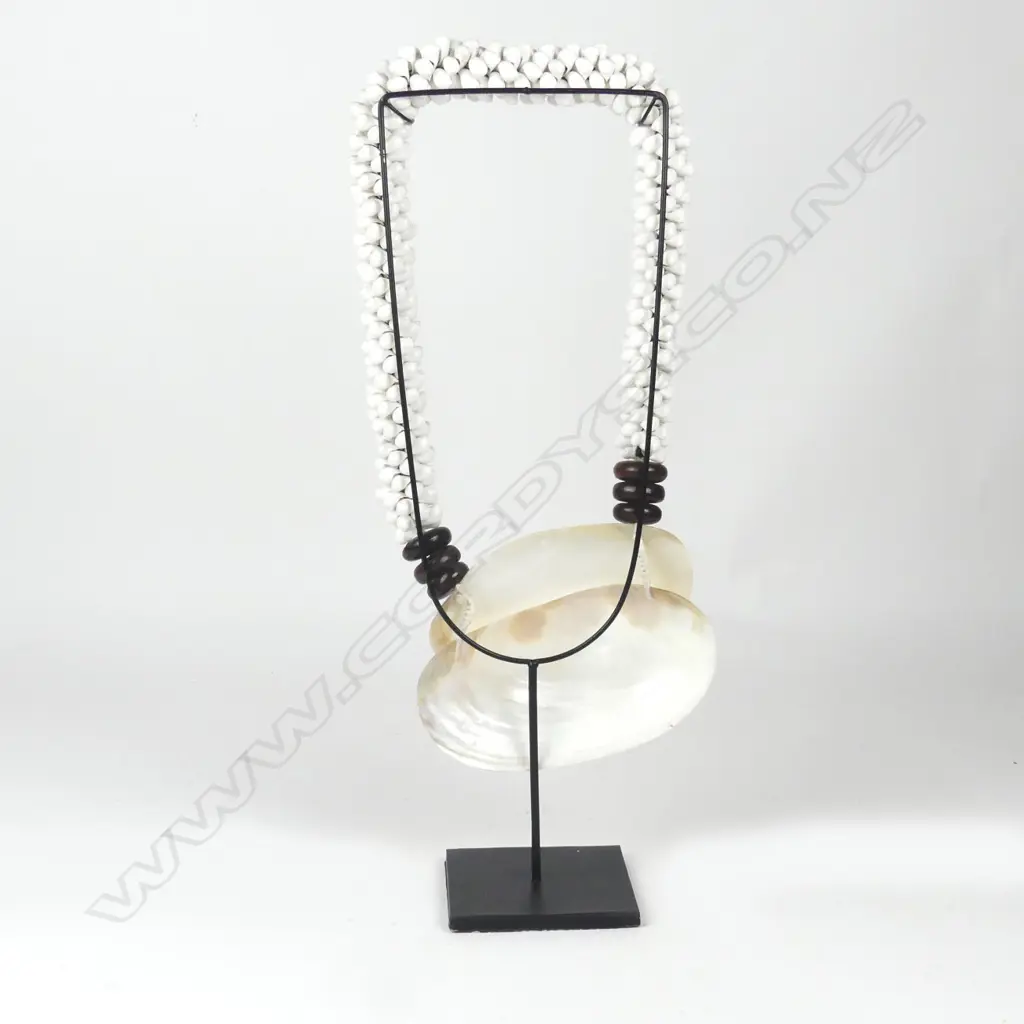 A Pacific mother of pearl and shell lei Image 1++