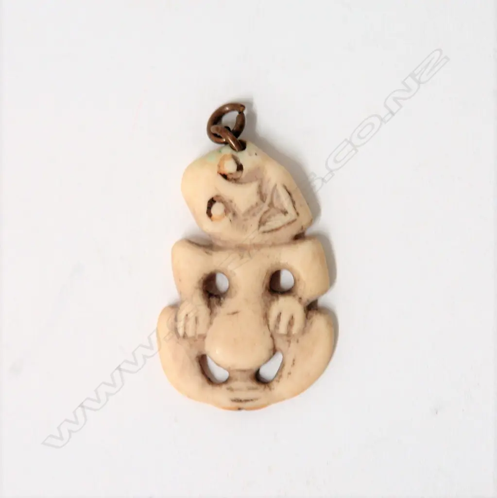 A small old marine ivory Maori hei tiki Image 1++