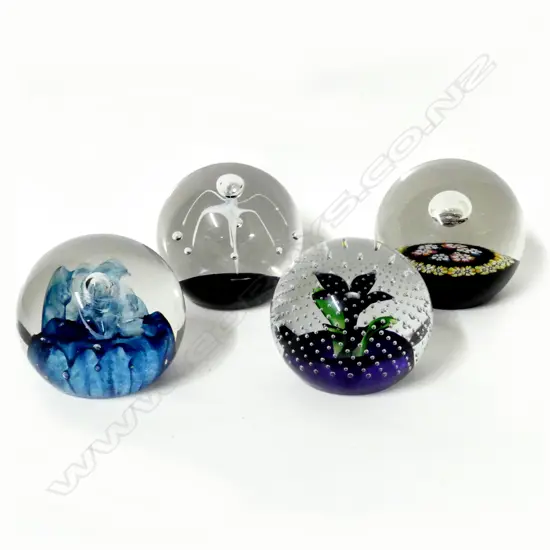 Four Caithness paperweights