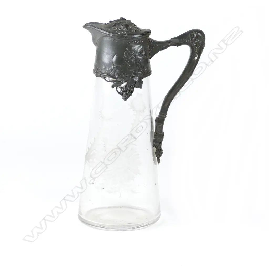 An Art Nouveau pewter and glass claret jug Image 1++