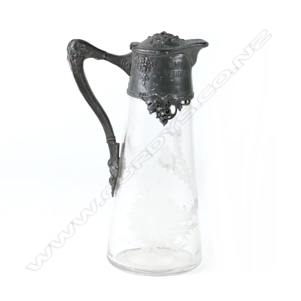 An Art Nouveau pewter and glass claret jug Image 1++