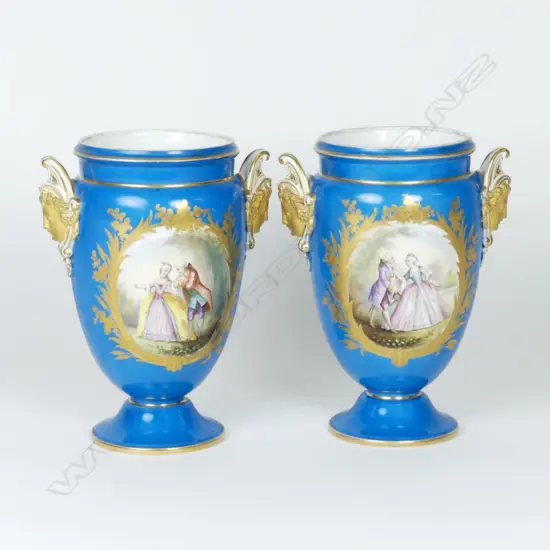 A pair of 19thC French Sèvres style porcelain urn vases