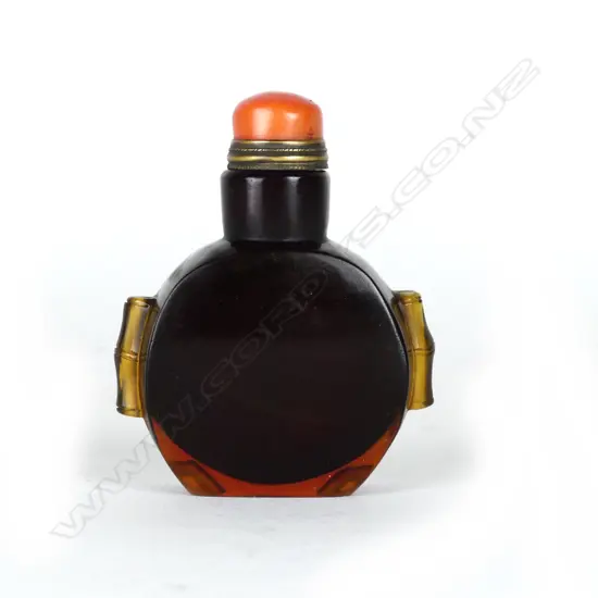 A dark amber Peking glass snuff bottle