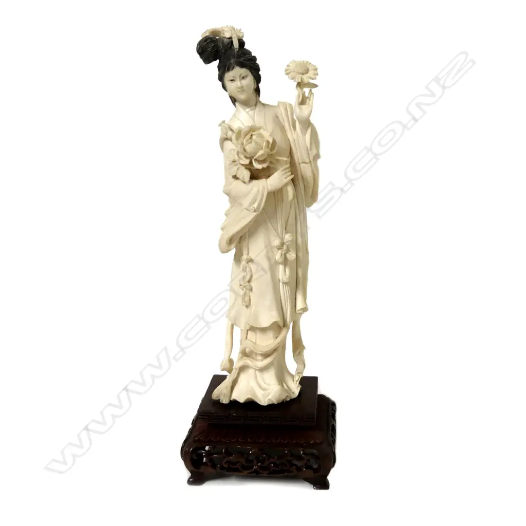 A carved Chinese ivory figure of a young woman Image 1++