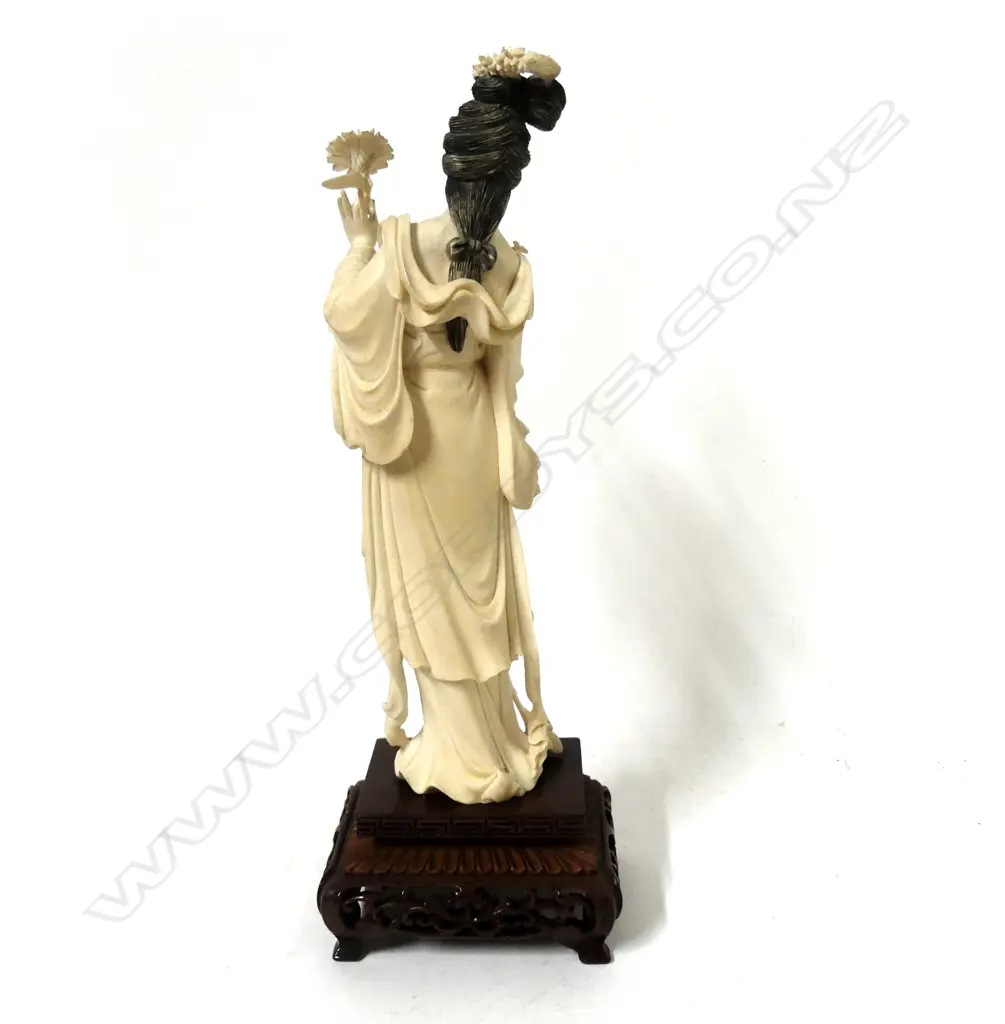A carved Chinese ivory figure of a young woman Image 1++