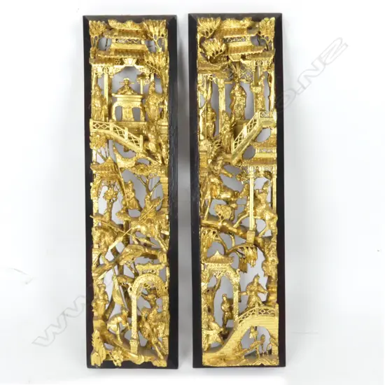 A pair of Chinese richly gilded carved and pierced wood panels