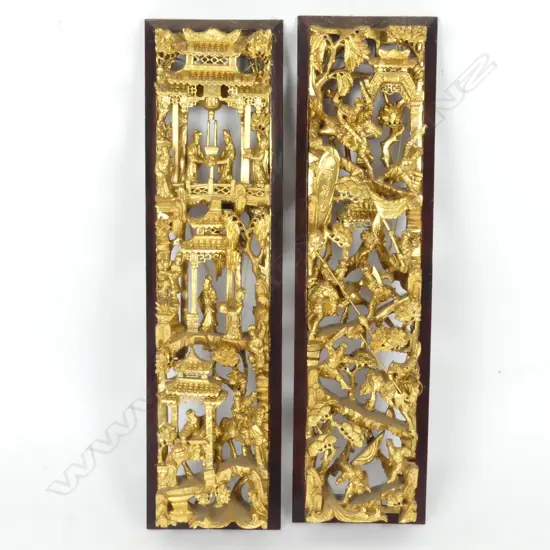 A pair of Chinese richly gilded carved and pierced wood panels