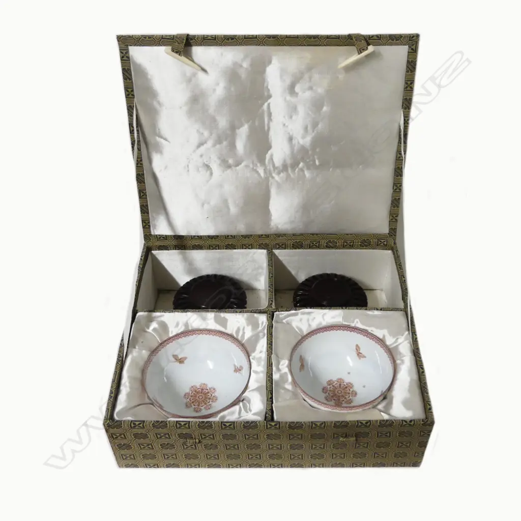 A pair of fine quality Chinese famille rose egg-shell porcelain circular bowls on short feet painted with scenes of young boys playing in a garden Image 1++