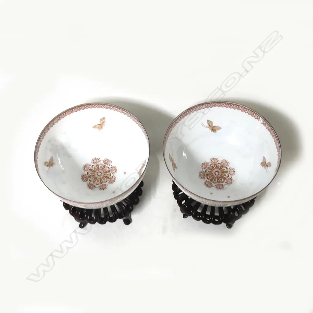 A pair of fine quality Chinese famille rose egg-shell porcelain circular bowls on short feet painted with scenes of young boys playing in a garden Image 1++