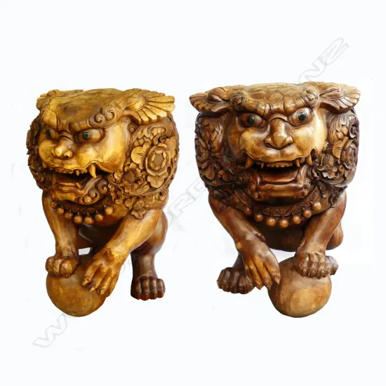 A pair of impressive hardwood carved Chinese foo dogs