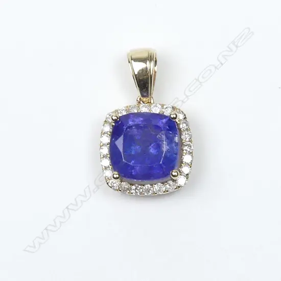 A14ct gold tanzanite and diamond pendant