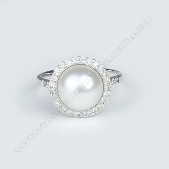 A 14ct white gold pearl and diamond ring