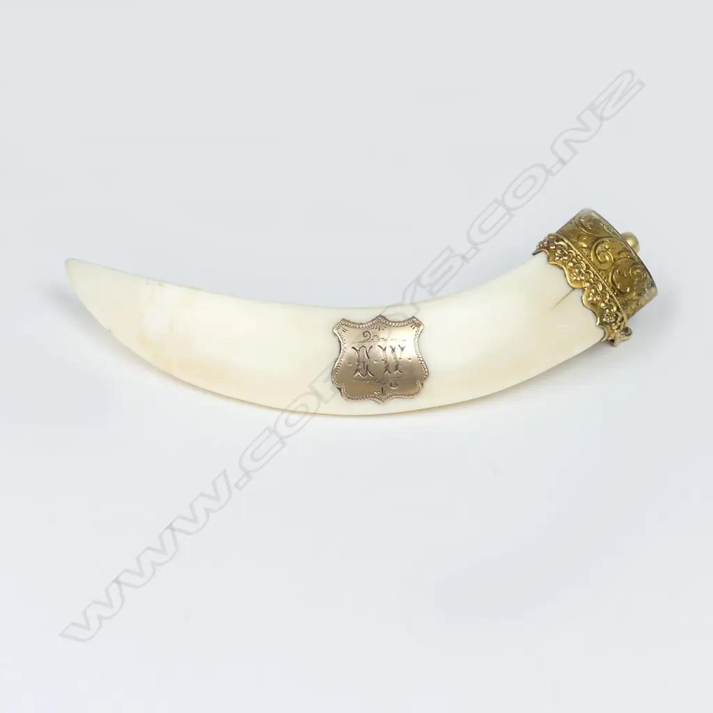 A 9ct. gold mounted boar's tusk pendant Image 1++