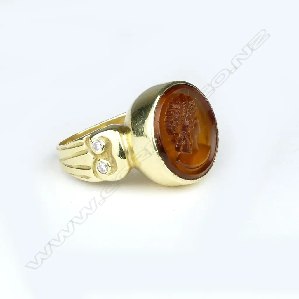An 18ct. gold topaz coloured panel and diamond ring Image 1++