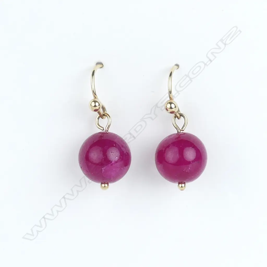 A pair of 9ct yellow gold and ruby earrings Image 1++