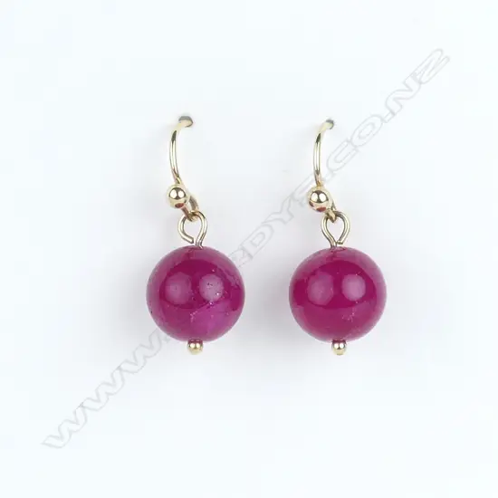 A pair of 9ct yellow gold and ruby earrings