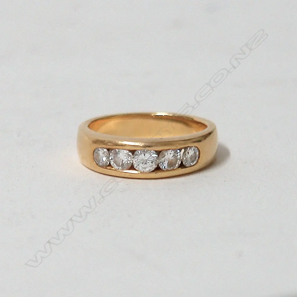 A heavy lady's 18ct. five stone diamond ring Image 1++