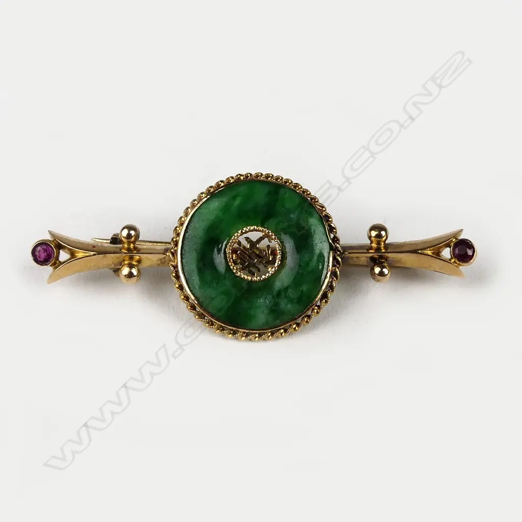 An 18ct gold jade and ruby bar brooch Image 1++