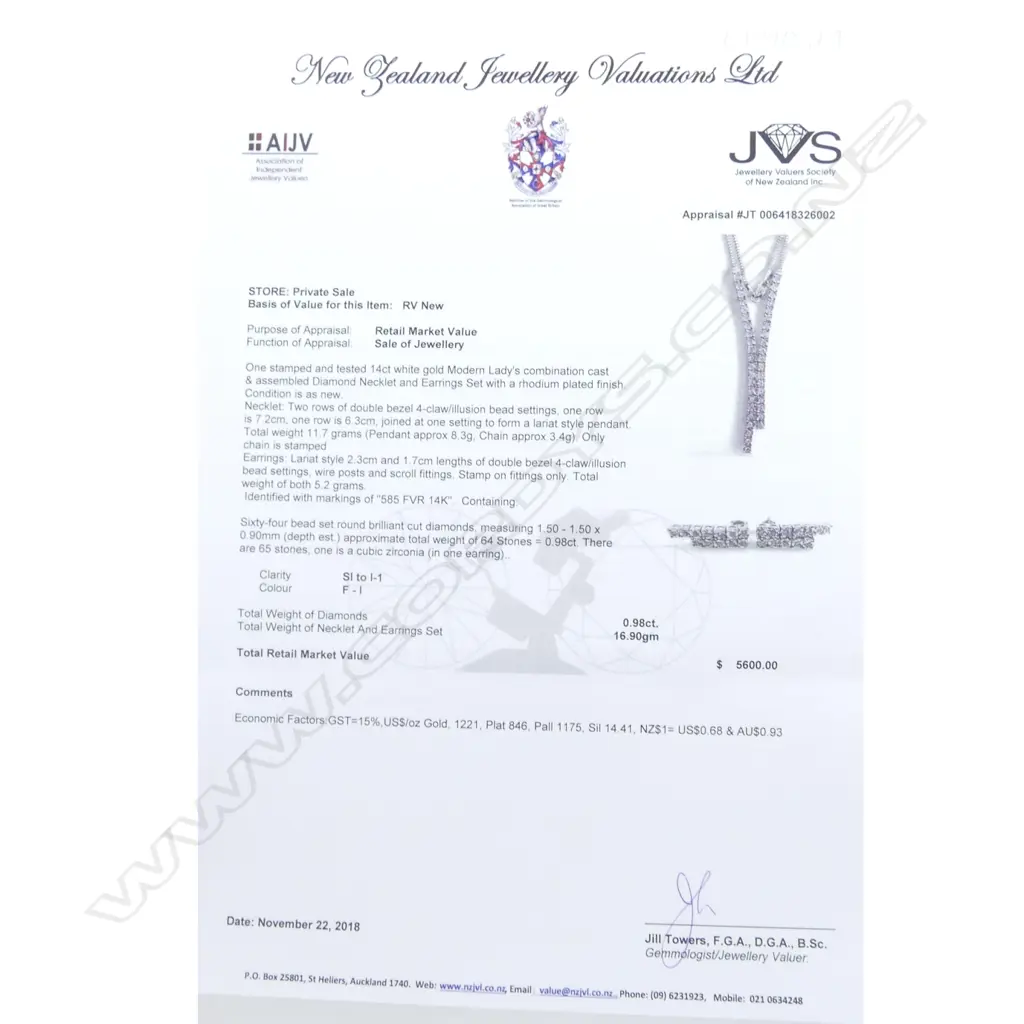 A 14ct white gold and diamond pendant and earrings set Image 1++