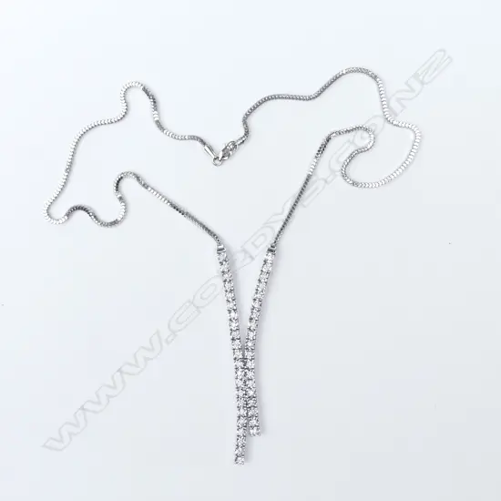 A 14ct white gold and diamond pendant and earrings set