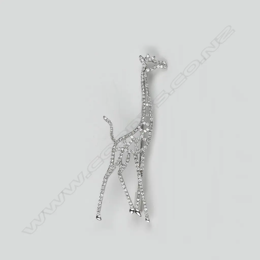 A modern 18ct. white gold diamond set giraffe brooch Image 1++