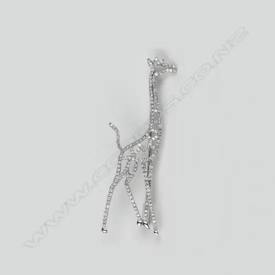 A modern 18ct. white gold diamond set giraffe brooch