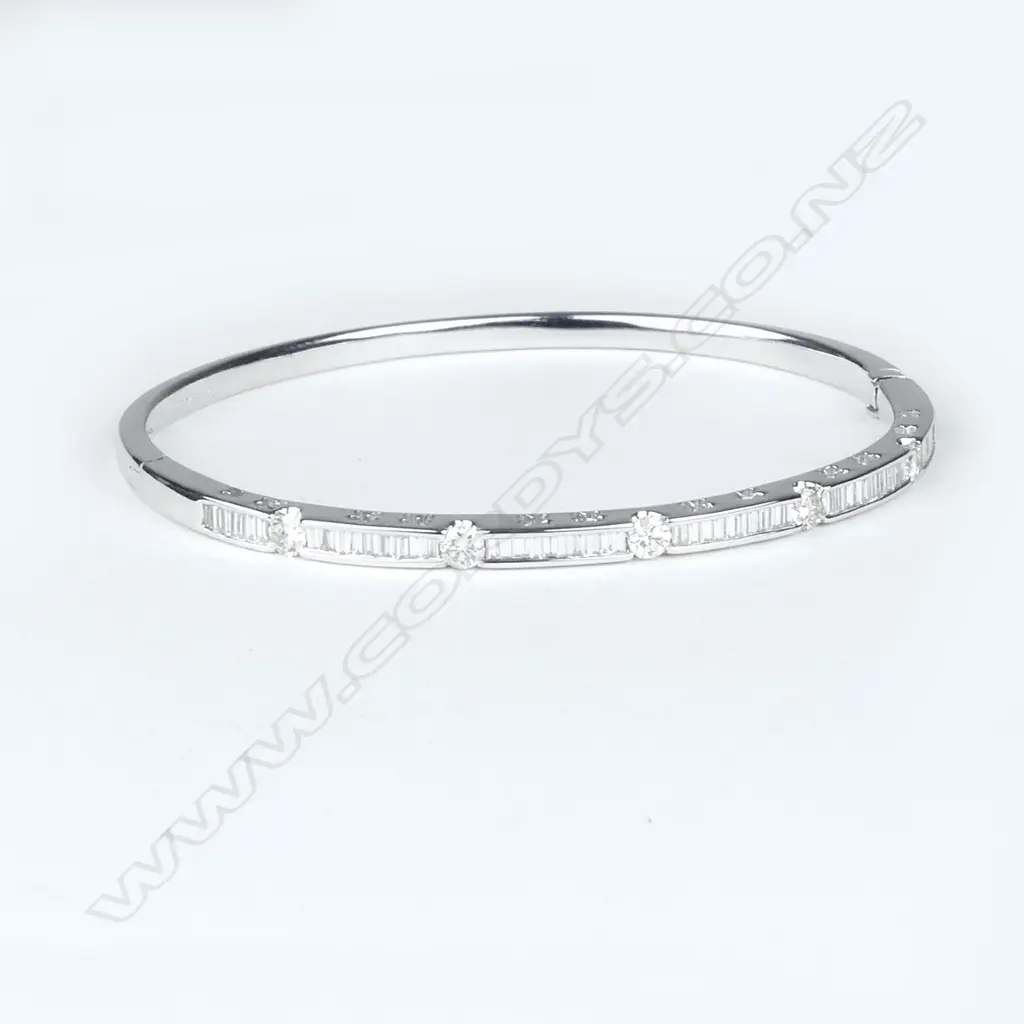 An 18ct white gold and diamond bangle Image 1++
