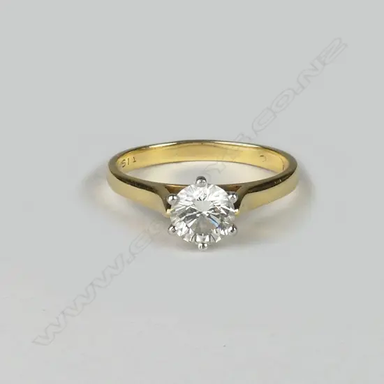 A lady's estate 18ct. yellow gold and platinum solitaire diamond ring