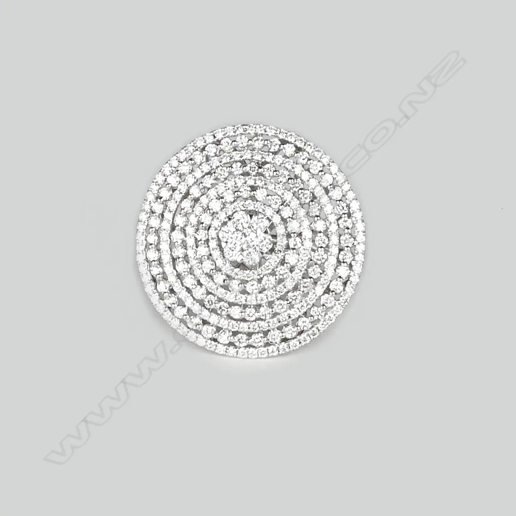A lady's modern 18ct. white gold and multi-diamond set large disc form ring Image 1++