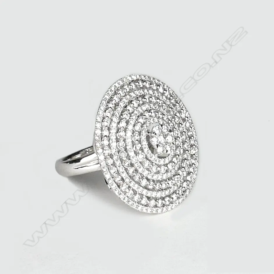 A lady's modern 18ct. white gold and multi-diamond set large disc form ring Image 1++