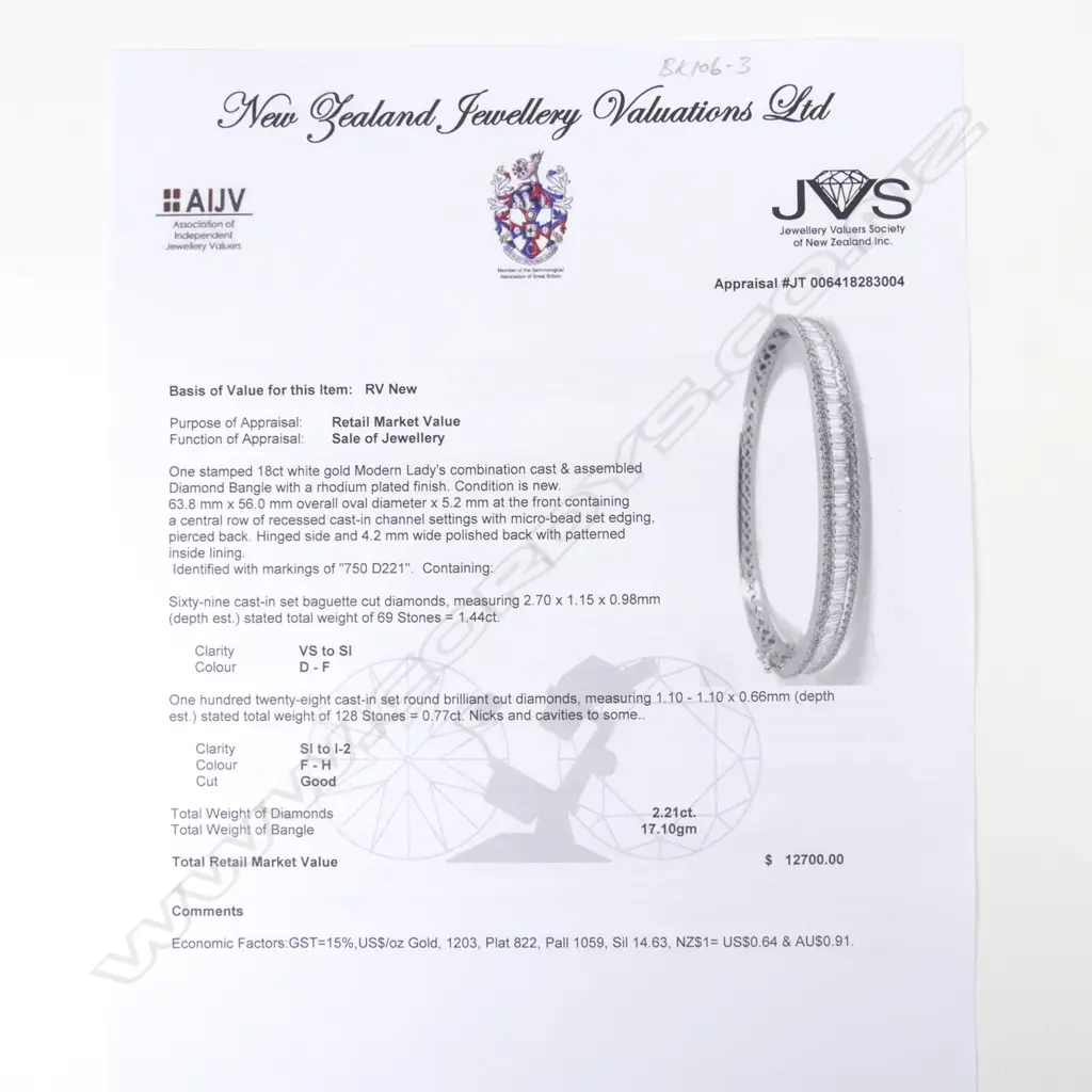 A lady's 18ct. white gold and diamond set half-hinged bangle Image 1++