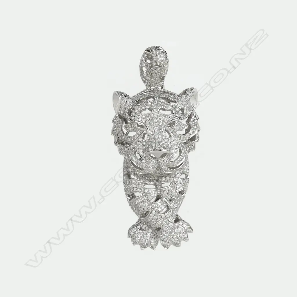 A modern 18ct. white gold and multi-diamond set panther pendant Image 1++