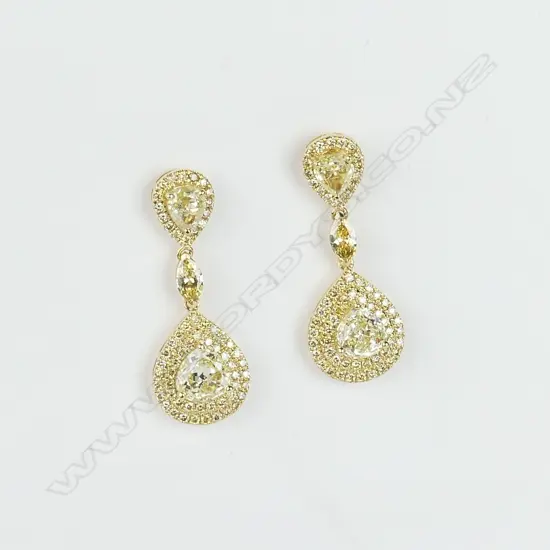 A pair of lady's modern 18ct. yellow gold and fancy yellow coloured diamond earrings