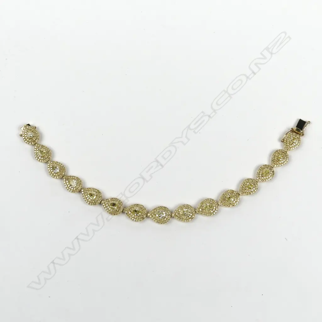 A stylish modern 18ct. yellow gold and multi-fancy yellow diamond set bracelet Image 1++