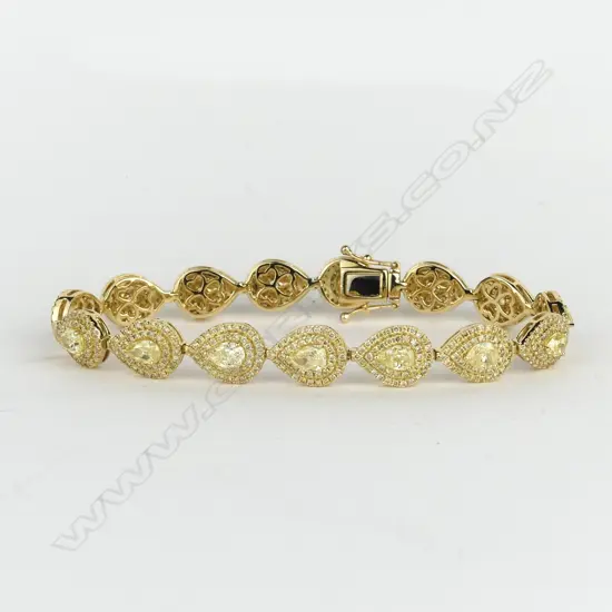 A stylish modern 18ct. yellow gold and multi-fancy yellow diamond set bracelet