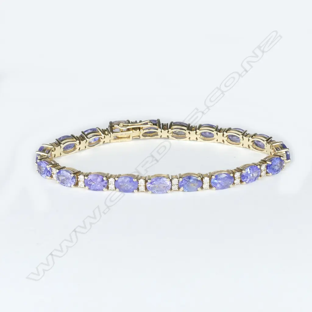 A 14ct gold tanzanite and diamond tennis bracelet Image 1++