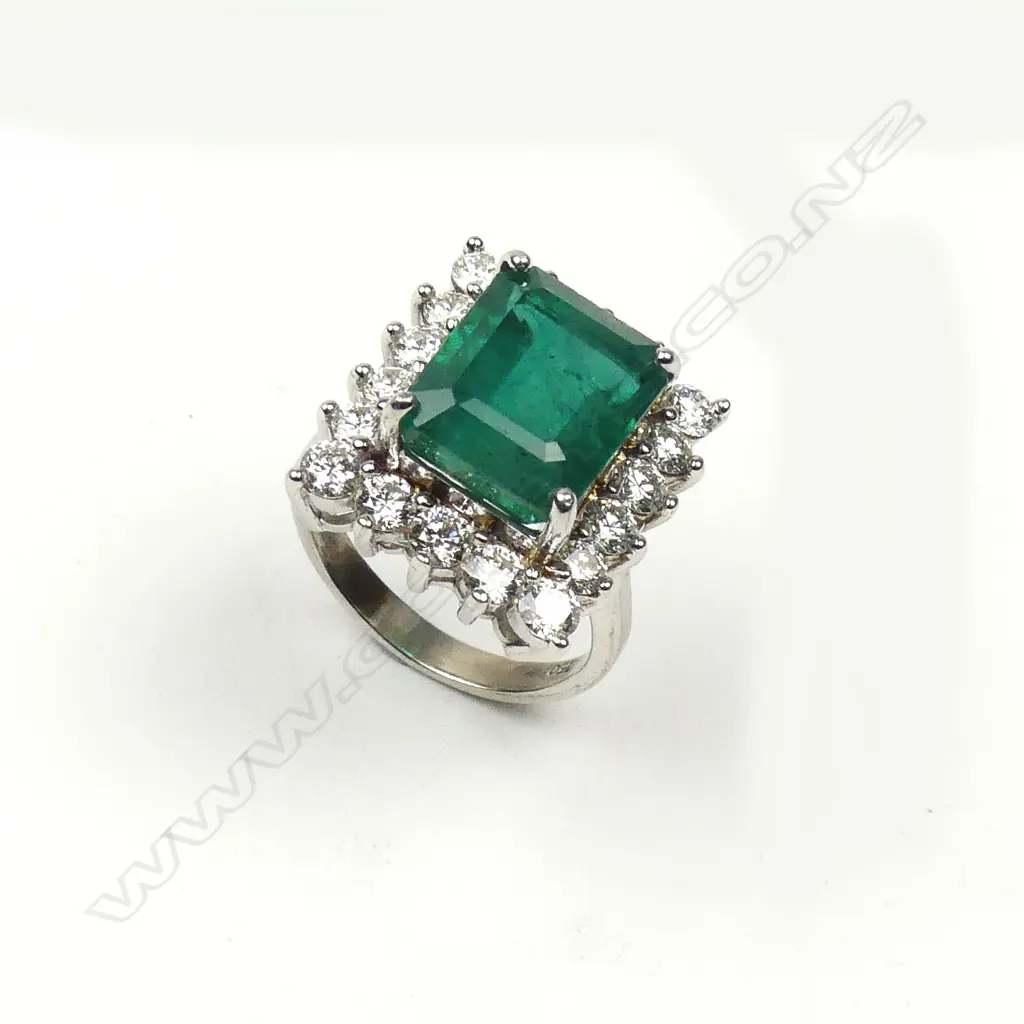 An 18ct white gold emerald and diamond ring Image 1++