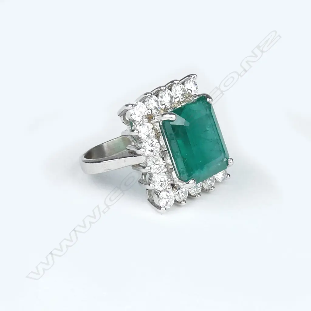 An 18ct white gold emerald and diamond ring Image 1++