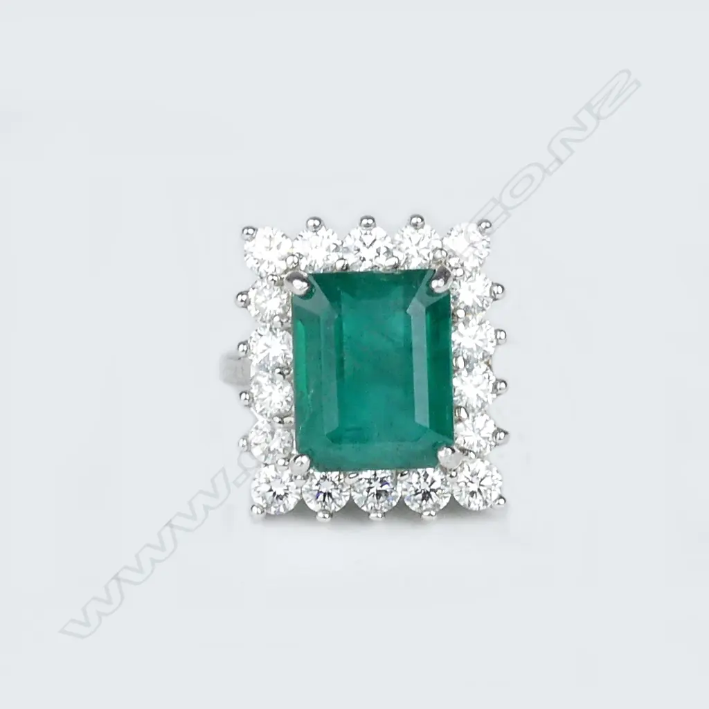 An 18ct white gold emerald and diamond ring Image 1++