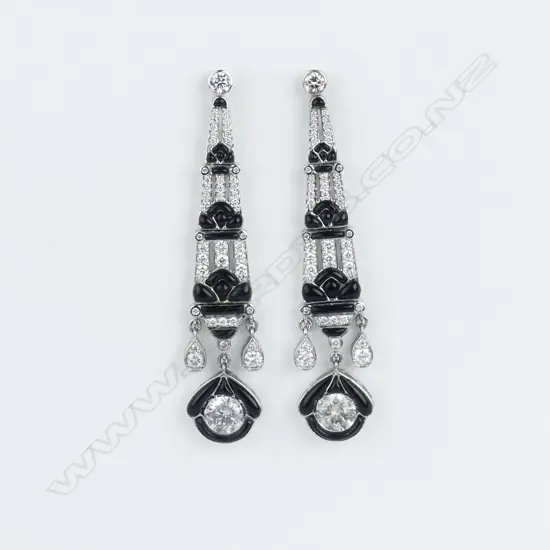 A pair of 9ct white gold diamond and onyx Art Deco style earrings