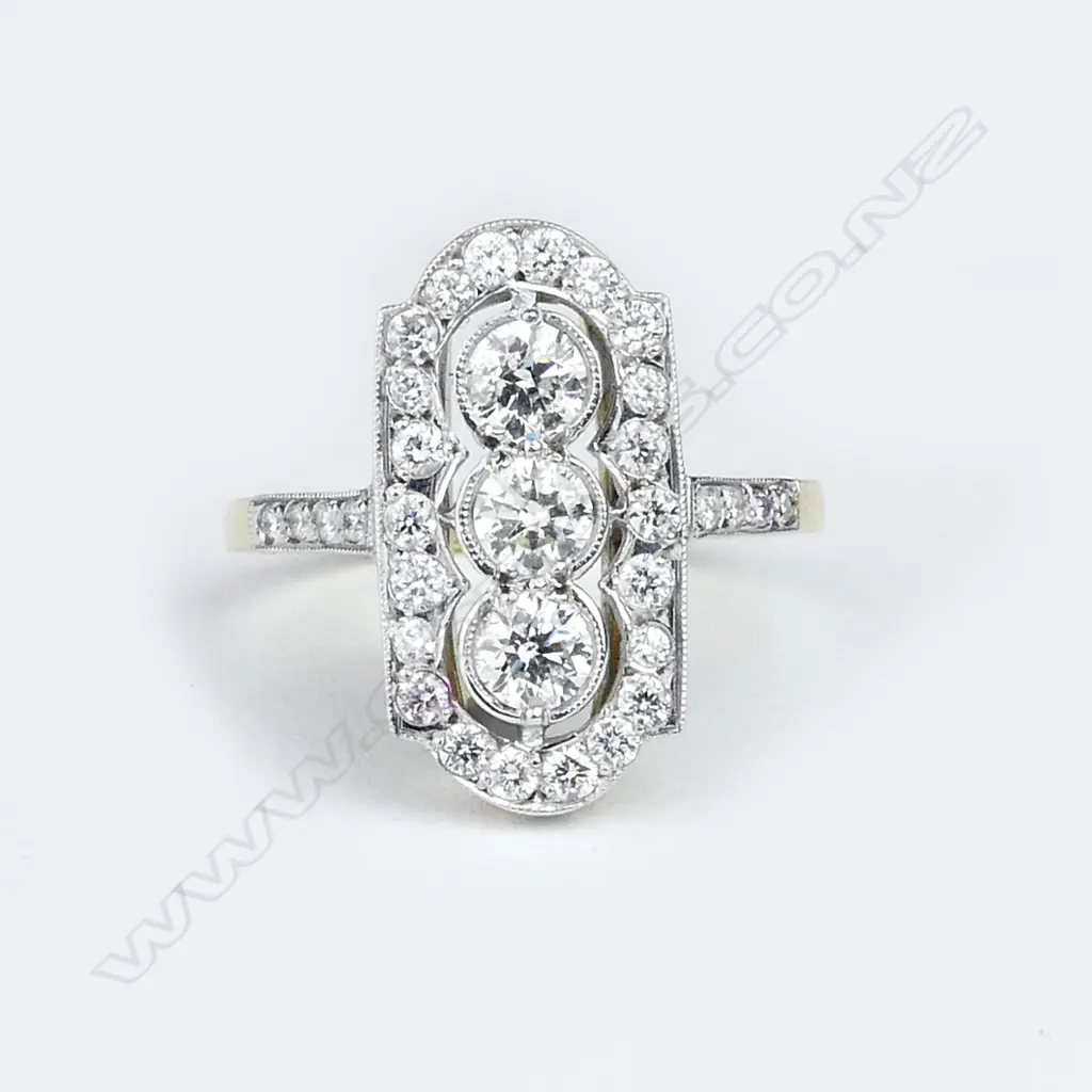 An Art Deco style 18ct. yellow gold and multi-diamond set  dress ring Image 1++