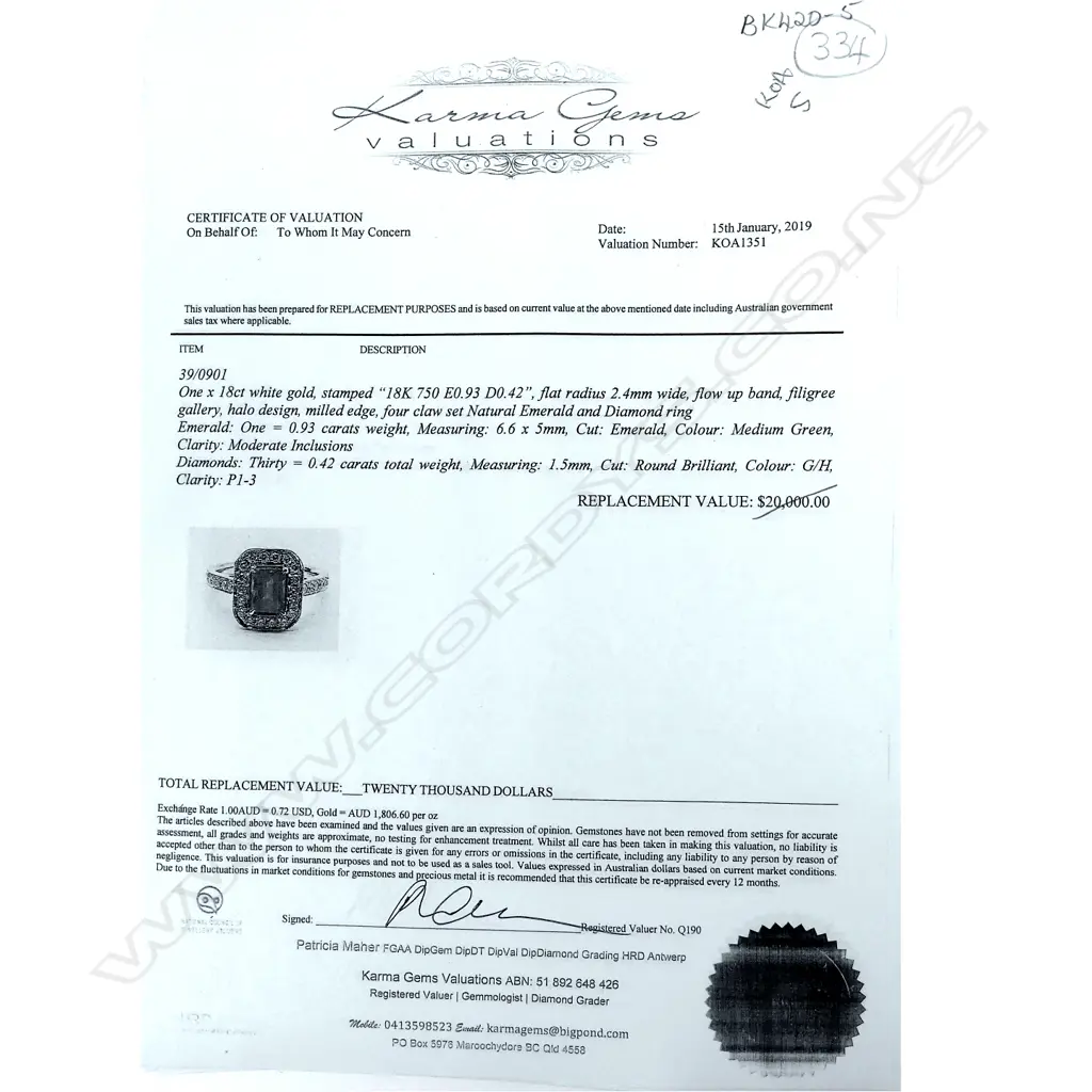 An 18ct white gold emerald and diamond ring Image 1++